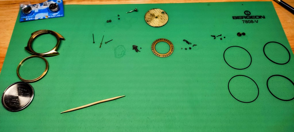 watchmaker's bench showing parts for the Longines ETA / ESA 940.111 movement